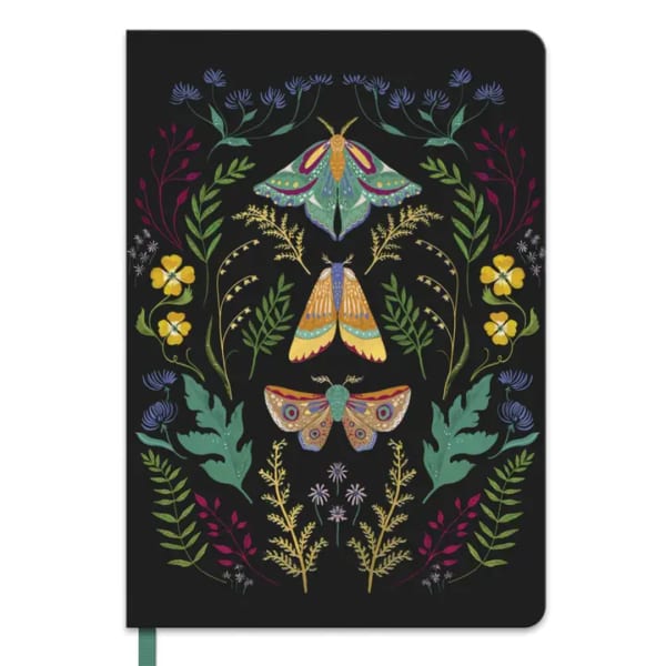 Black notebook with colorful moth and floral illustrations on the cover