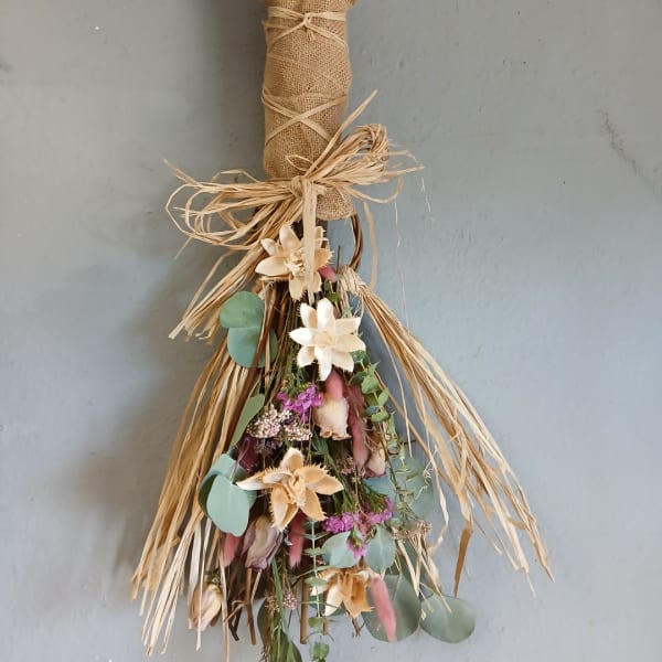 Dried floral bundle with cream flowers and raffia bow