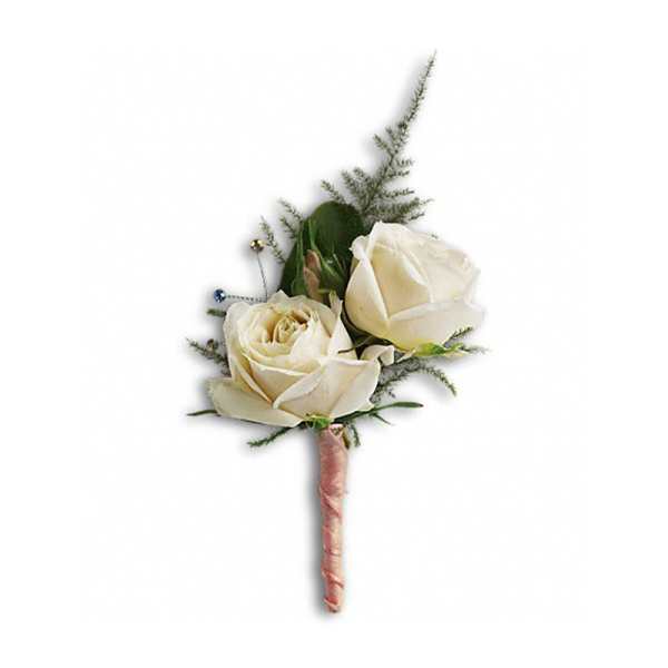 White rose boutonniere with greenery and a pink wrapped stem