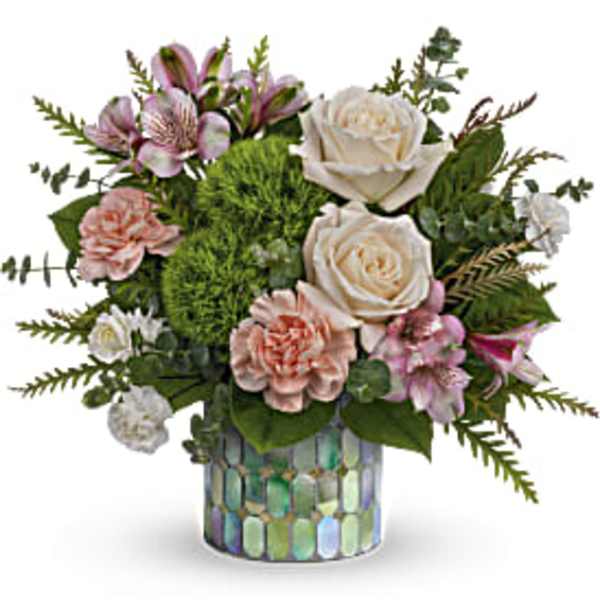 Bouquet of pink and white flowers in a mosaic glass vase