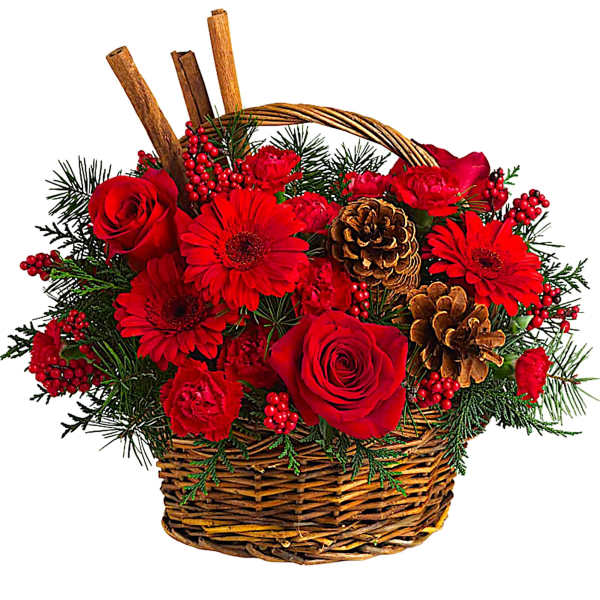 Red roses and gerbera daisies in a wicker basket with pinecones