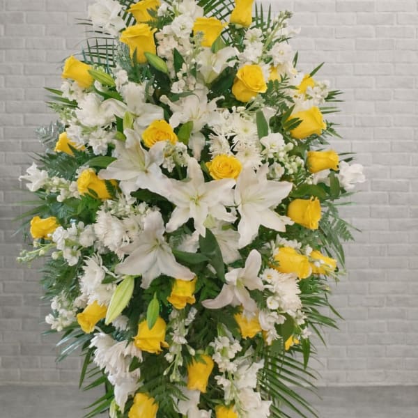 Standing floral spray with white lilies and yellow roses