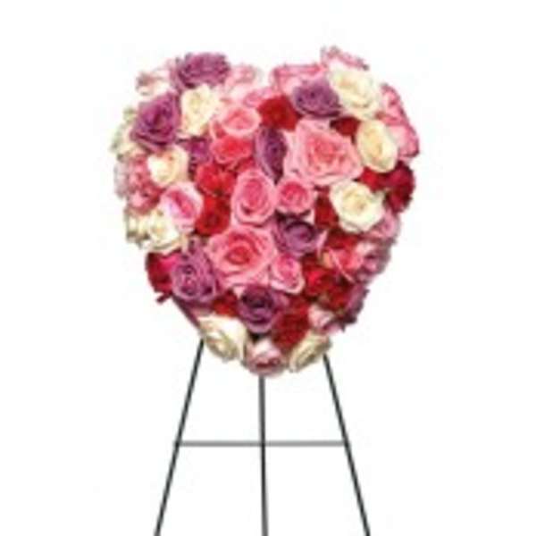 Heart-shaped rose arrangement on a stand