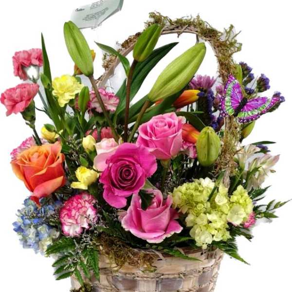 Mixed flower basket with roses, lilies, carnations, and a butterfly pick