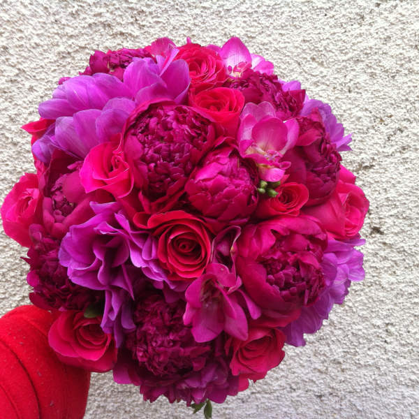 Round bouquet of hot pink and purple flowers