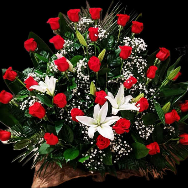 Large bouquet of red roses and white lilies with baby's breath
