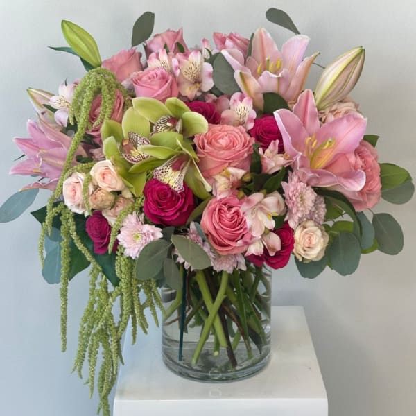 Pink and white mixed bouquet in a clear glass vase