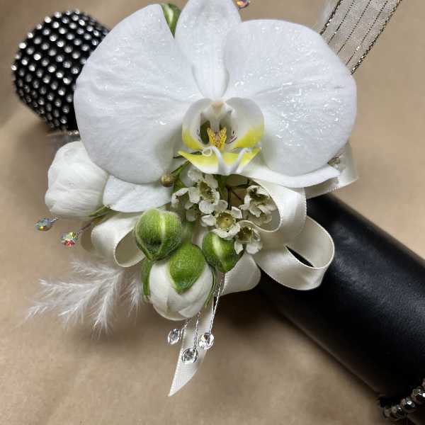 White orchid corsage with ribbon and crystal accents
