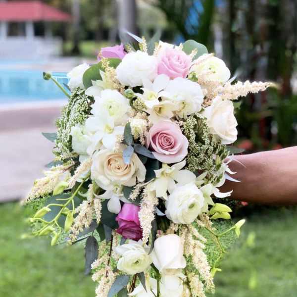 Trailing bouquet of pink and white roses with cascading white orchids