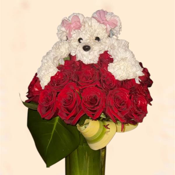 Red rose bouquet arranged as a teddy bear in a glass vase