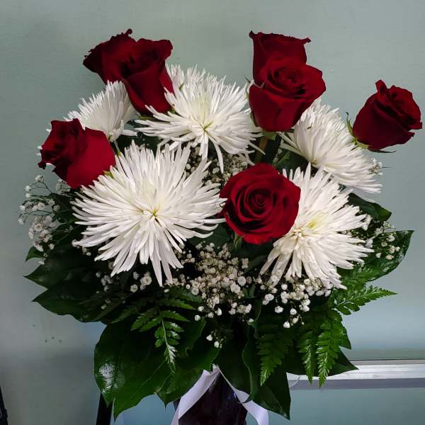 Bouquet of red roses and white spider mums with baby's breath
