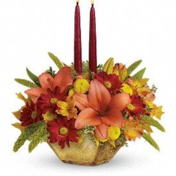 Autumn floral centerpiece with two red taper candles