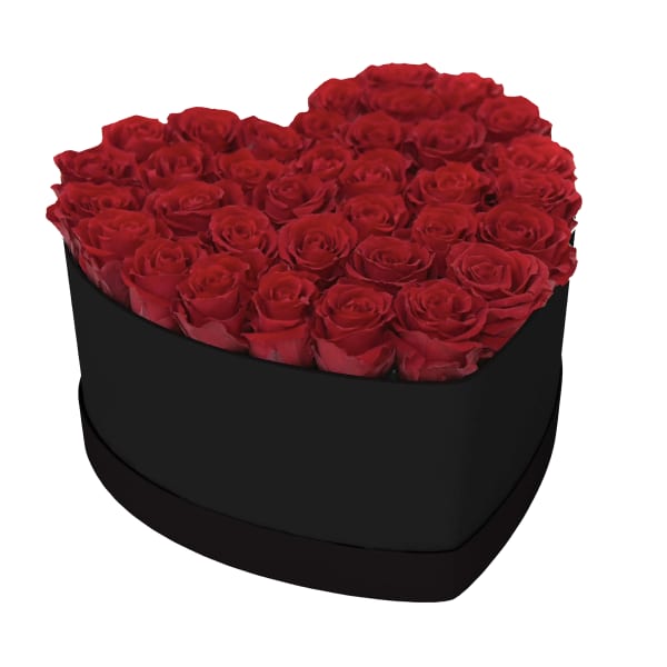 Heart-shaped box filled with red roses