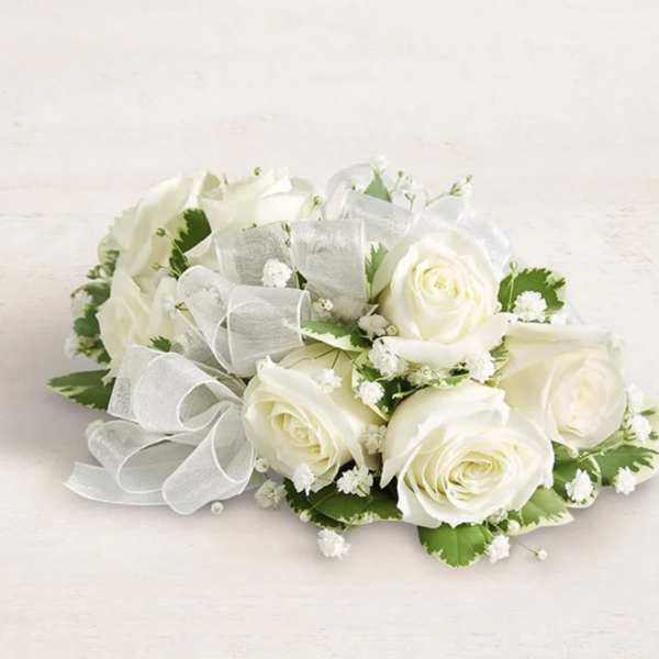 White rose bouquet with baby's breath and a sheer ribbon bow