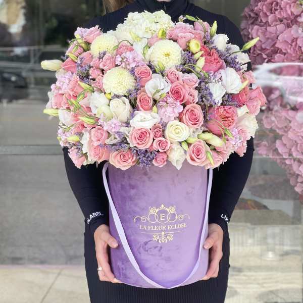 Large pink and white rose bouquet in a purple hatbox