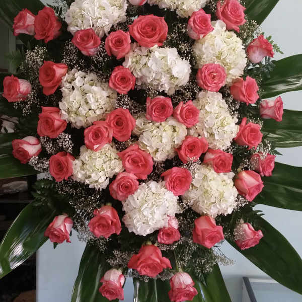 Large standing floral spray with pink roses and white hydrangeas