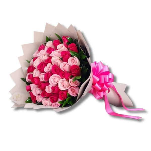 Bouquet of pink and hot pink roses wrapped in beige paper with a pink ribbon
