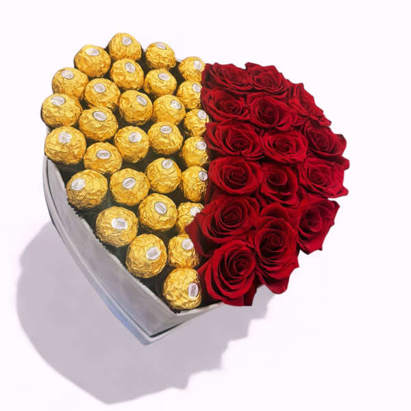 Heart-shaped box with red roses and gold-wrapped chocolates