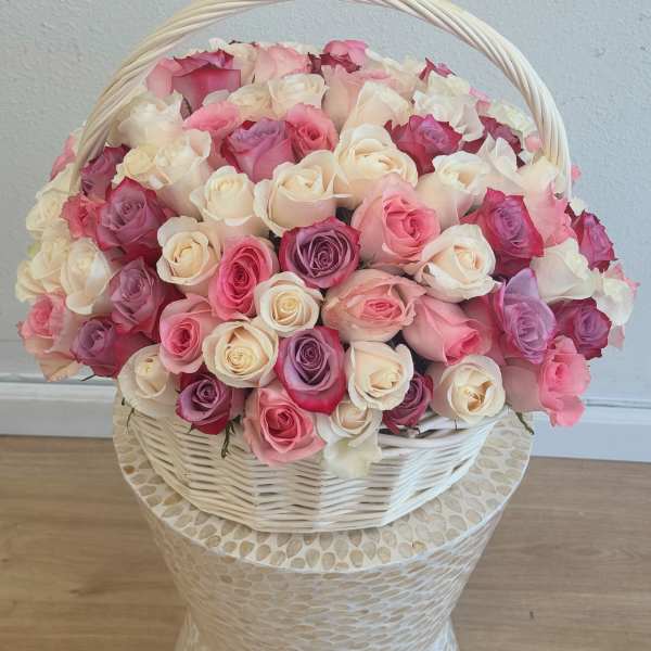 Basket of pink, white, and lavender roses