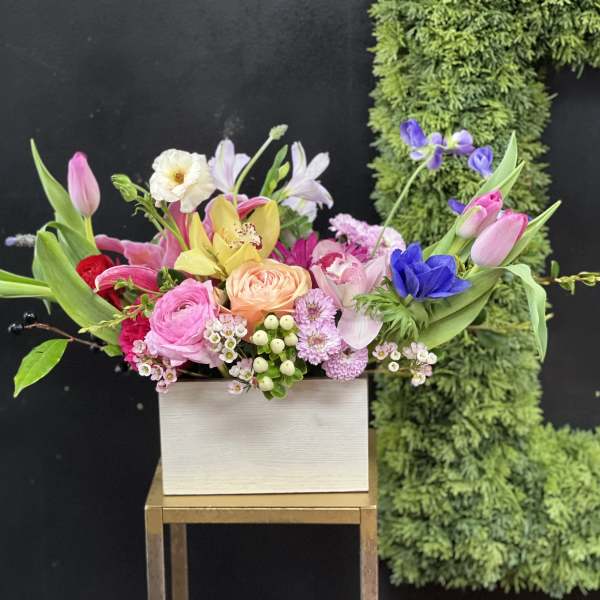 Colorful mixed bouquet in a white rectangular box