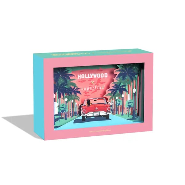 Pink and teal gift box with a Hollywood-themed illustration