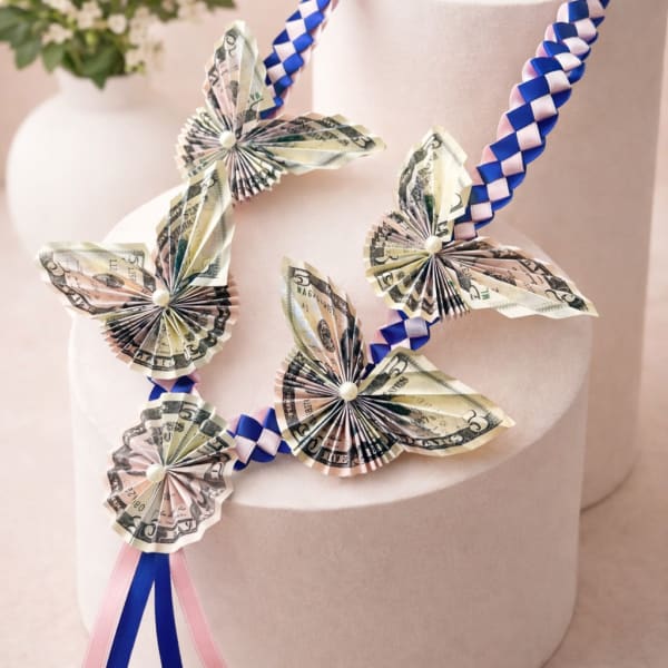 Lei of folded dollar butterflies