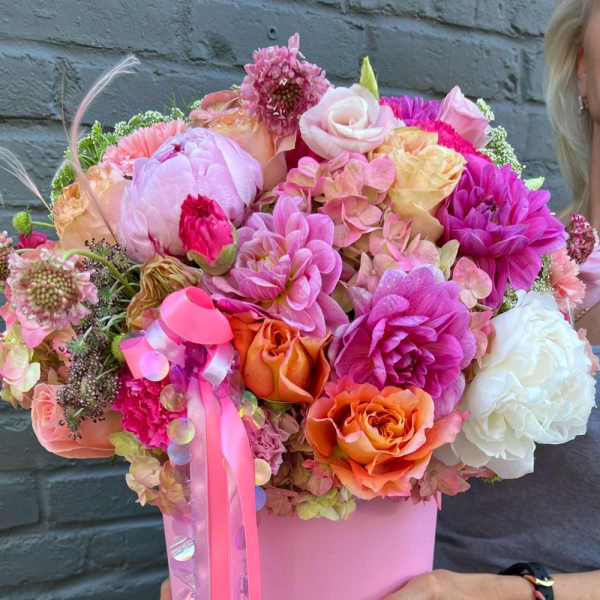 Pink and orange mixed bouquet in a pink box with ribbon