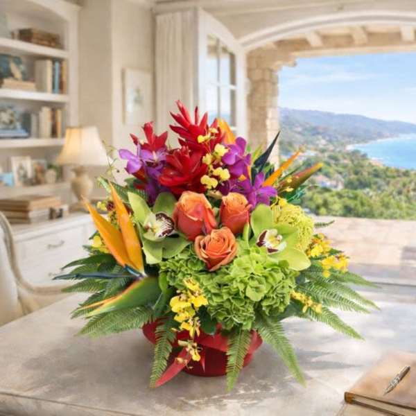 Tropical bouquet with orchids, roses, and bird-of-paradise in a red container