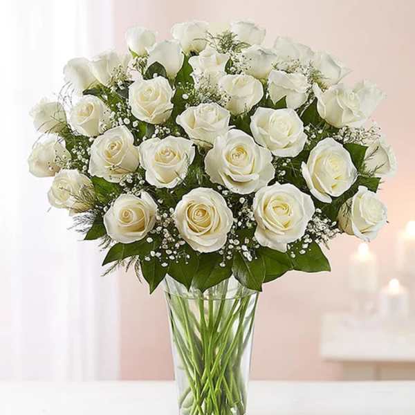 Bouquet of white roses in a clear glass vase