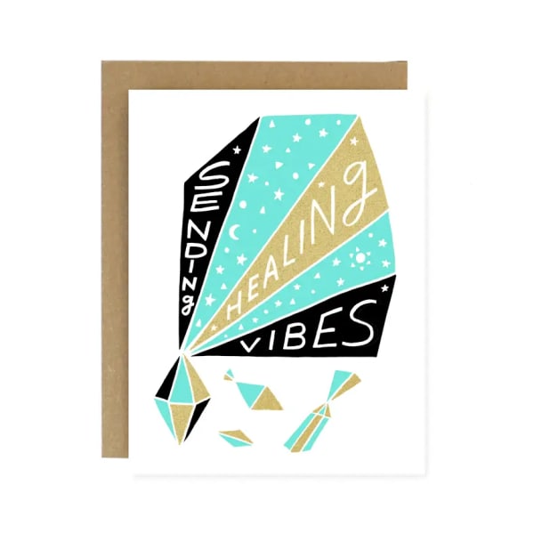 Greeting card with a colorful kite and the words "sending healing vibes"