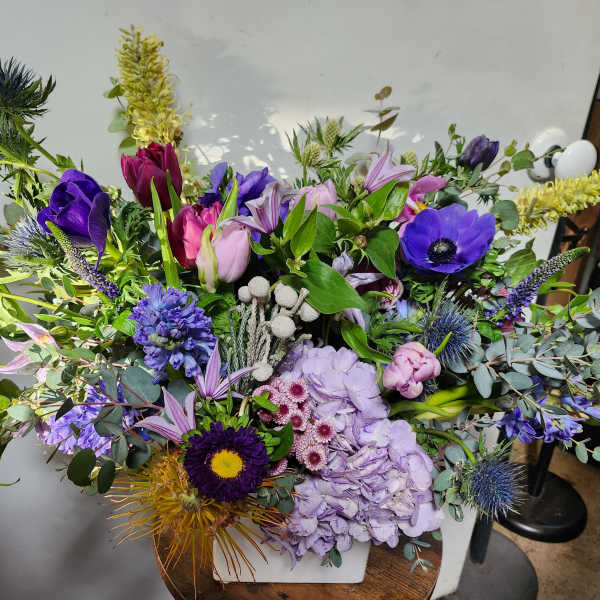 Large mixed bouquet with purple, pink, and yellow flowers