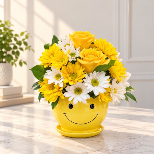 Yellow roses and white daisies in a smiley-face yellow pot