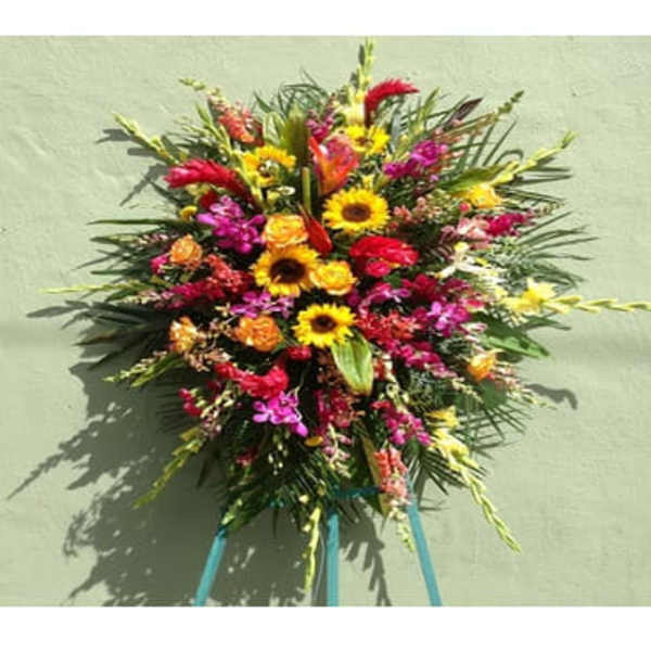Large colorful standing floral spray with sunflowers and orchids