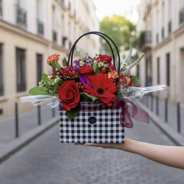 Red rose and gerbera bouquet in a checkered gift box