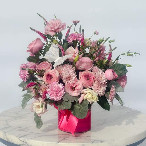 Pink mixed bouquet in a bright pink box with a ribbon
