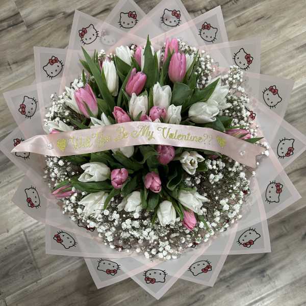 Pink and white tulip bouquet with a Valentine ribbon and Hello Kitty wrap