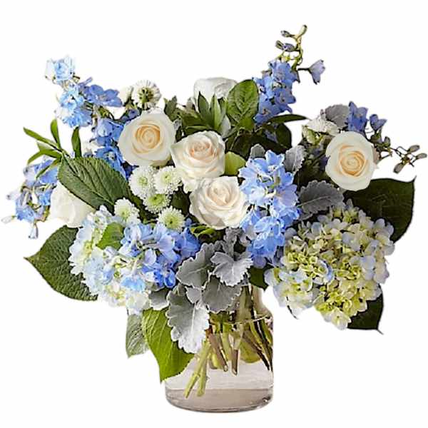 Blue and white flower arrangement in a clear glass vase