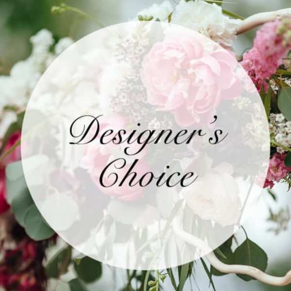 Pink and white floral arrangement with a "Designer’s Choice" label