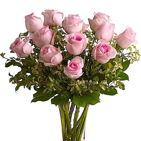 Bouquet of pale pink roses in a clear glass vase