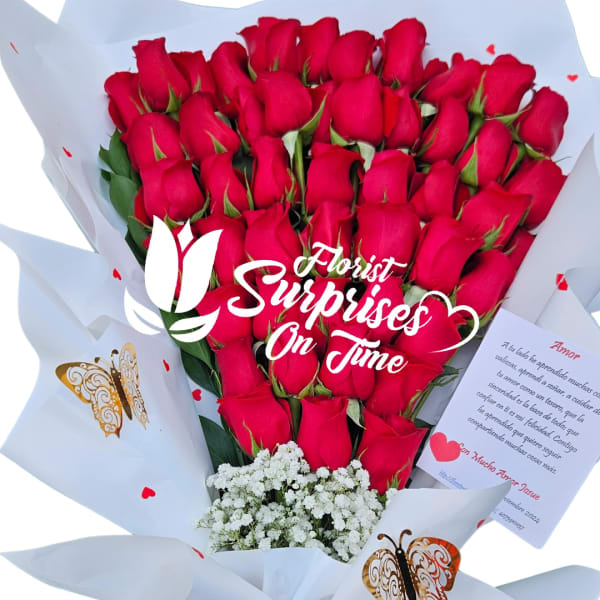 Bouquet of red roses wrapped in white paper with a red ribbon