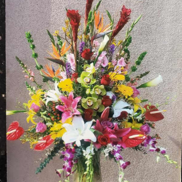 Colorful mixed flower arrangement in a glass vase