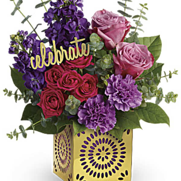 Pink and purple roses with carnations in a gold vase