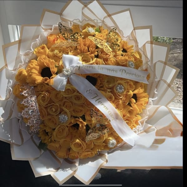 Large yellow rose and sunflower bouquet with white ribbon, jewels, and gold butterfly accents