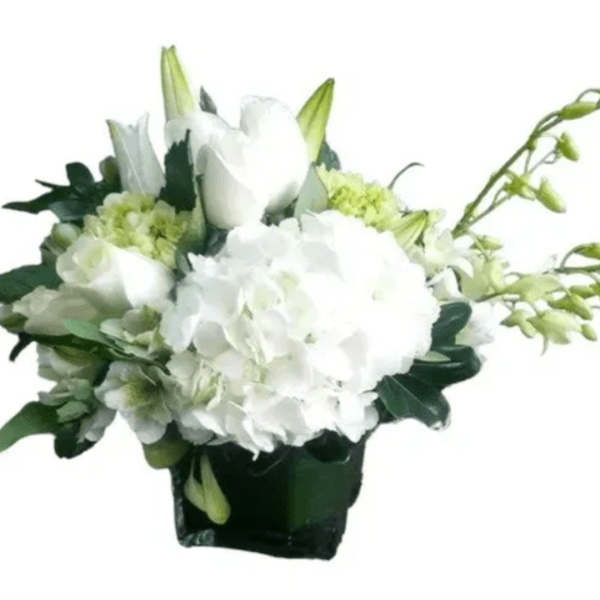 White floral arrangement in a dark square vase