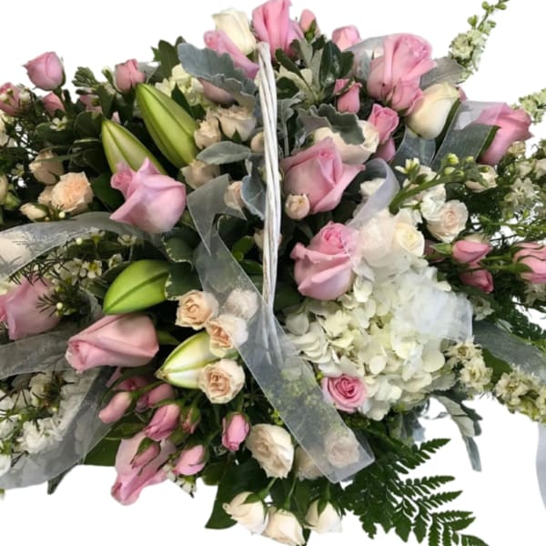 Large bouquet of pink and white roses with lilies and hydrangeas