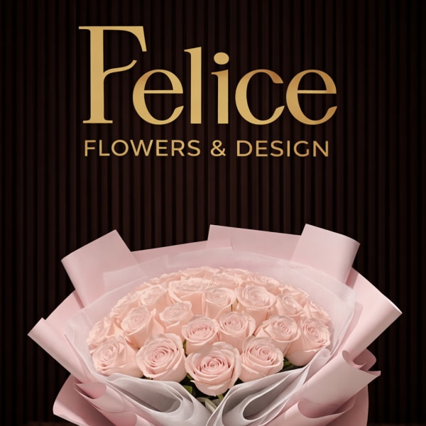 Bouquet of pale pink roses wrapped in pink paper
