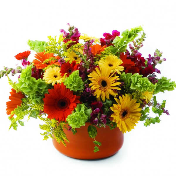 Colorful mixed bouquet in an orange vase