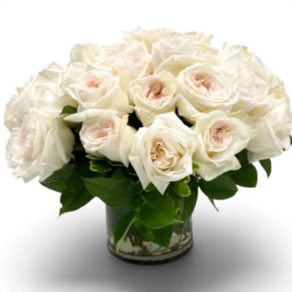 White rose bouquet in a clear glass vase