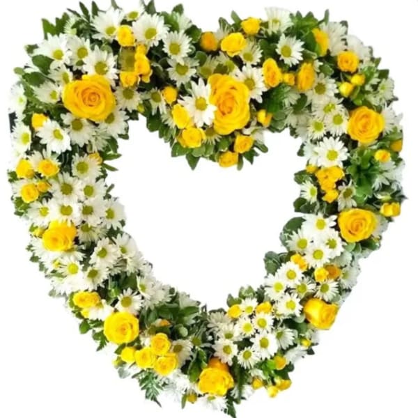 Heart-shaped floral wreath with yellow roses and white daisies