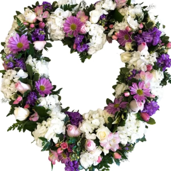 Heart-shaped floral wreath with white, pink, and purple flowers